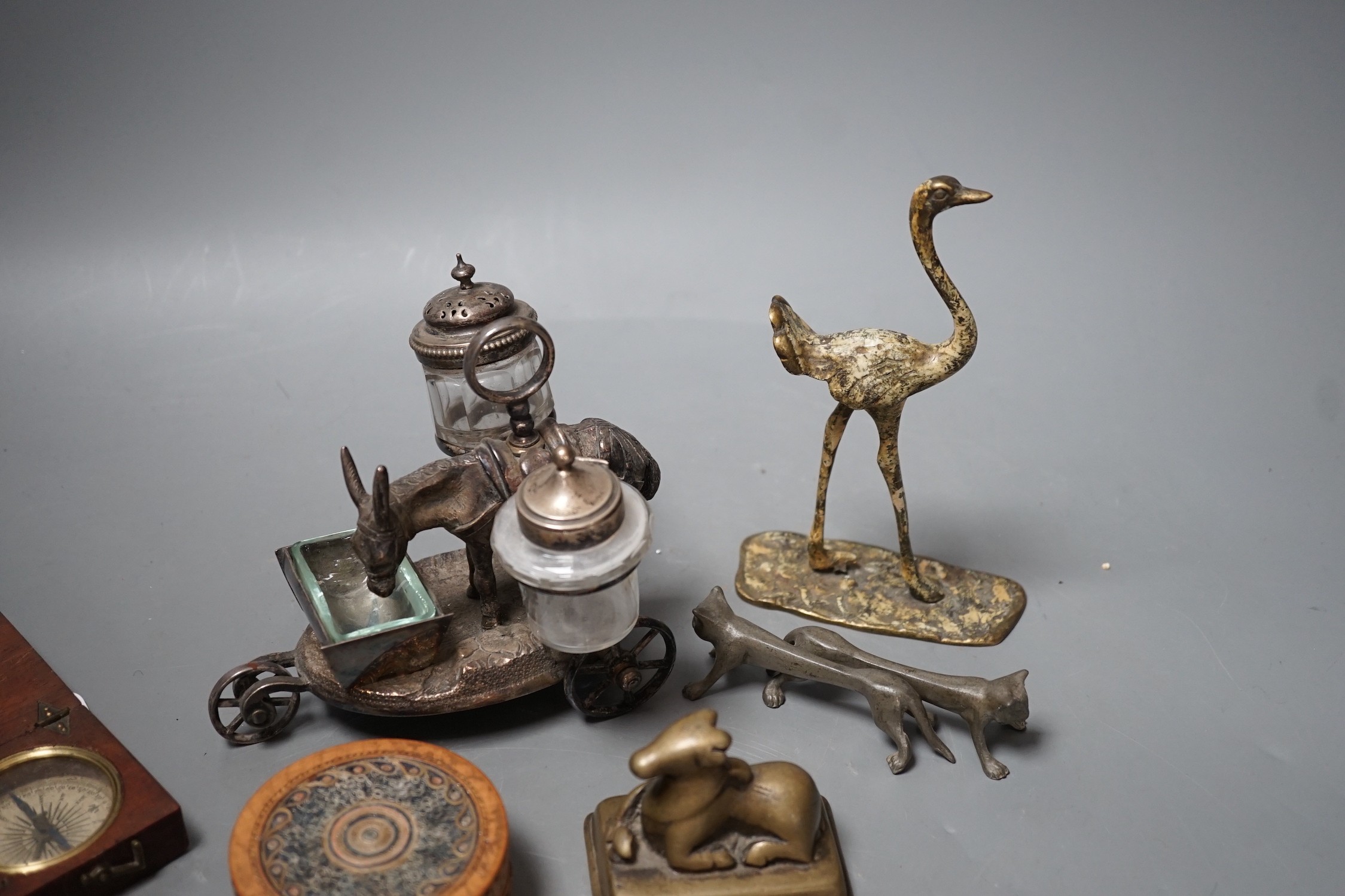 A selection of various miscellaneous items, to include a pair of 19th century cock fighting spurs, a rolled paperwork circular box and cover, a novelty plated donkey cruet, Tibetan box etc.